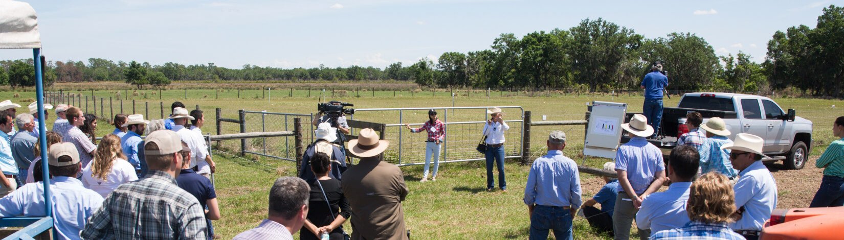 Attendees listening to a speaker at a field day at the Range Cattle REC