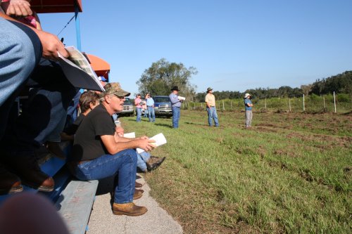attemdees listen to an informative presentation during the field tour at weed field day 2008